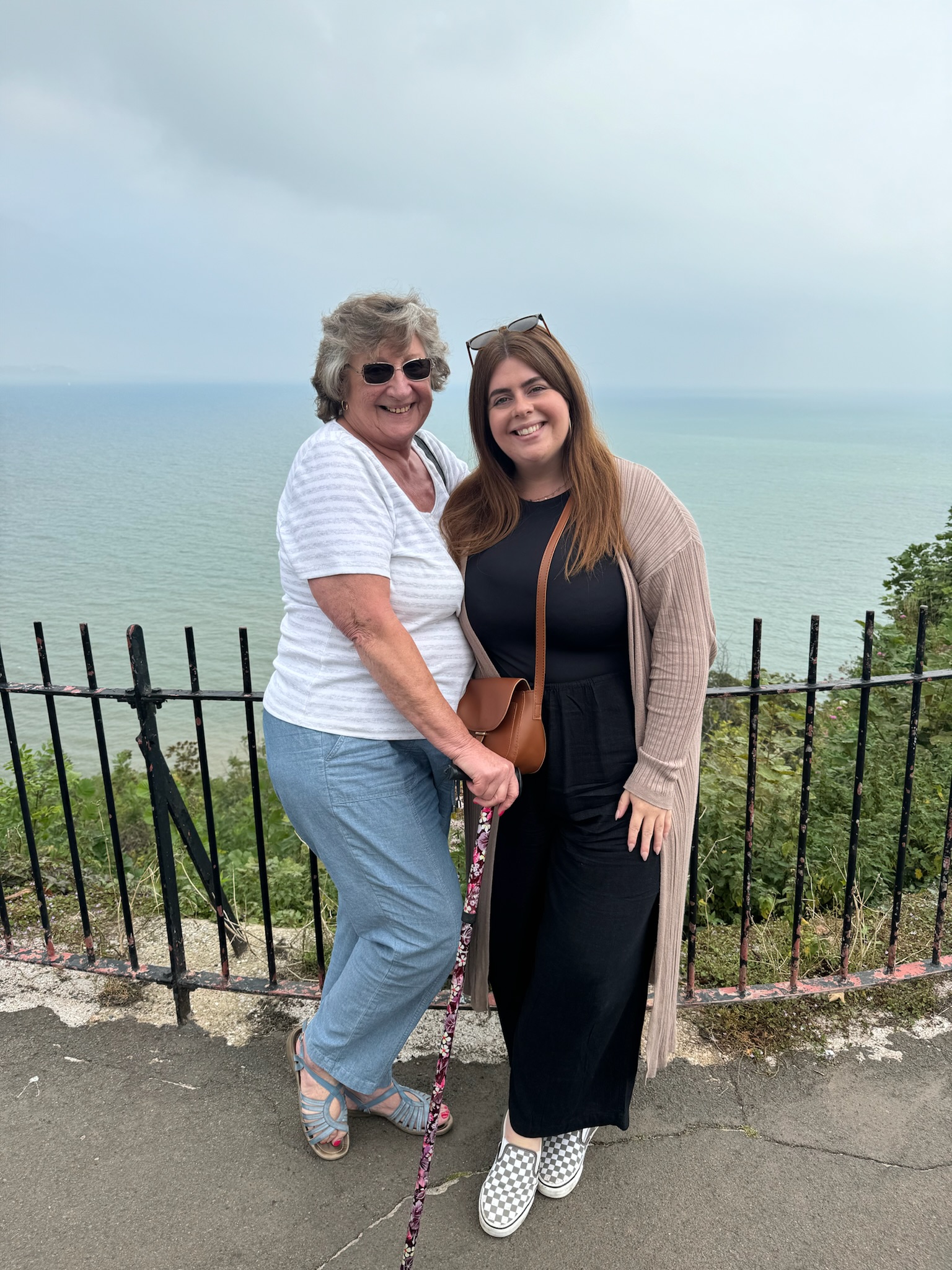 Carer with client enjoying seaside outing