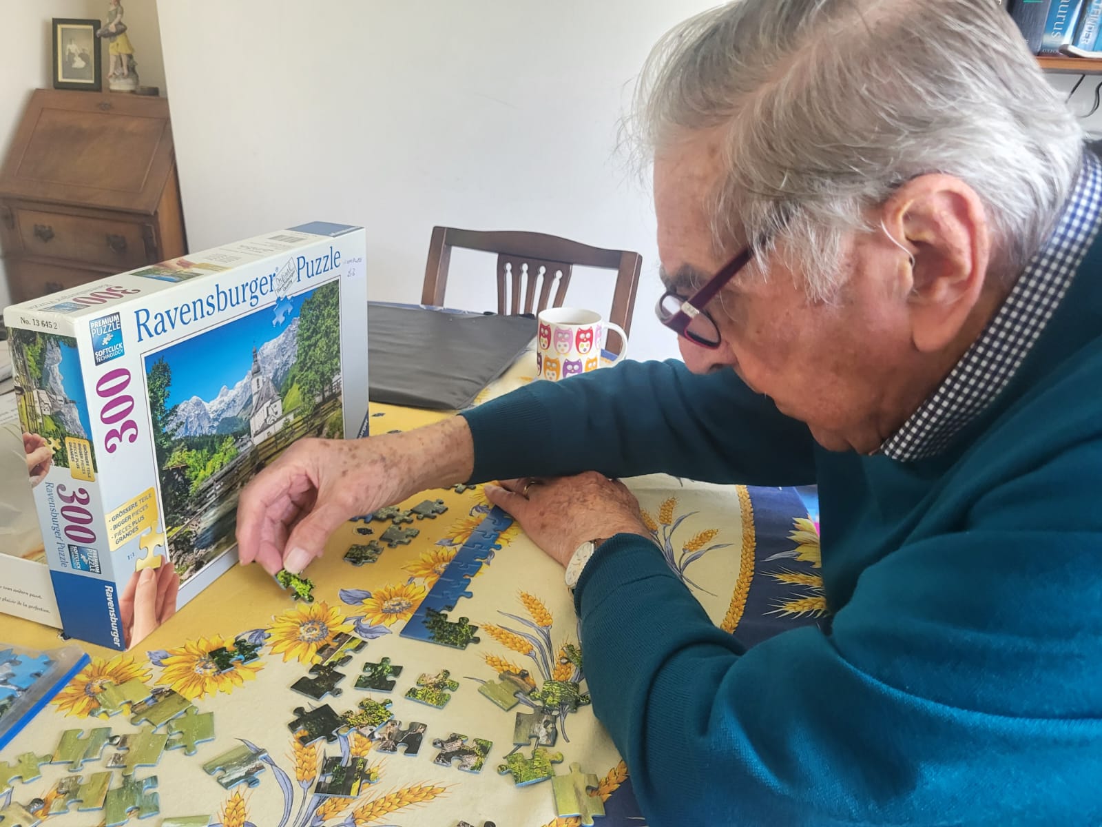 Client doing puzzle at home